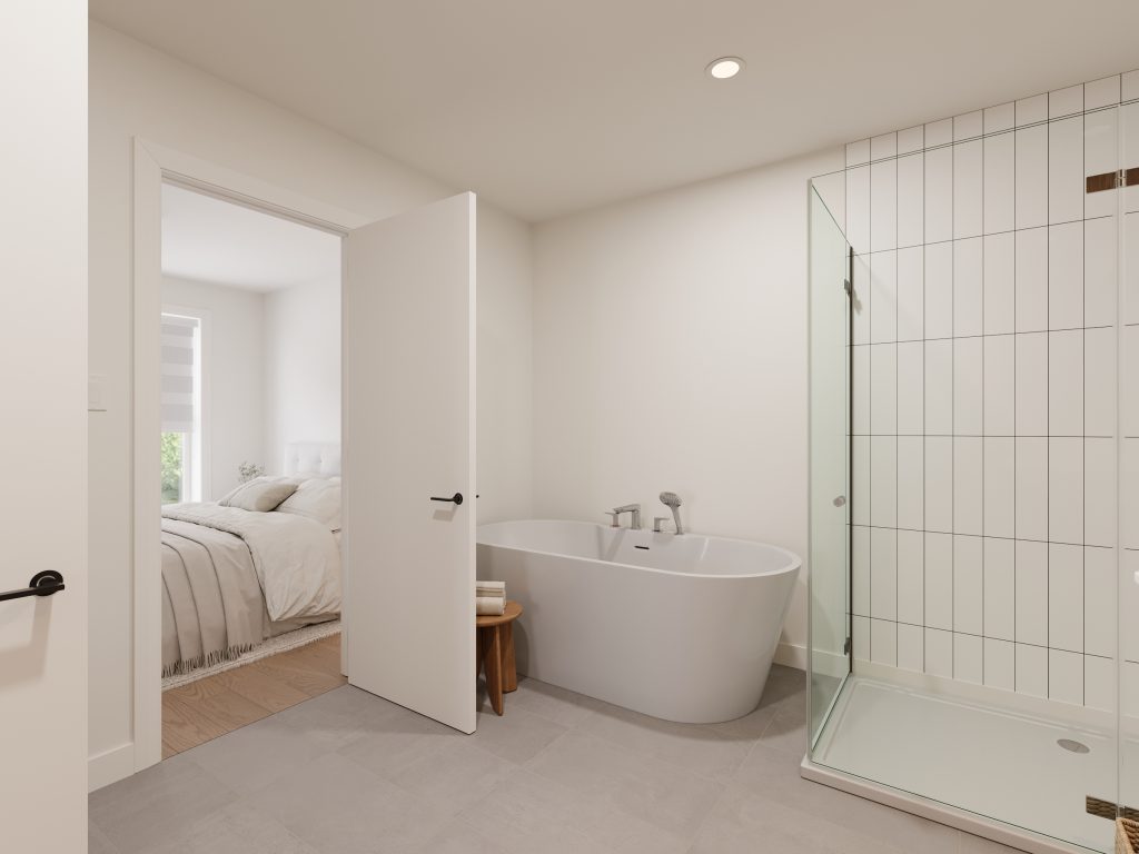 Salle de bain moderne avec bain autoportant et douche vitrée dans un condo neuf - Gestion Floria